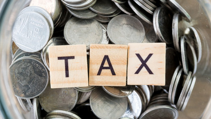 Taxes print text on wood square block