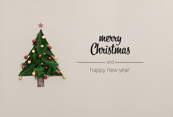 Merry Christmas and happy new year greetings in vertical top view cardboard with natural eco decorated christmas tree pine.Ecology concept.Xmas winter holiday season social media card background 