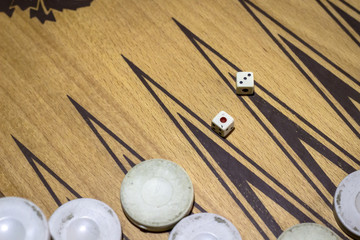 Contrast shoot of dice of backgammon under dim light