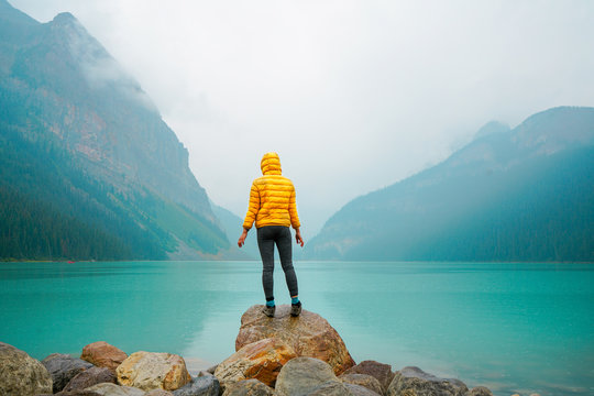 Woman Hiking By The Lake