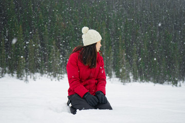 Fototapeta na wymiar Snowfall on top of a frozen lake