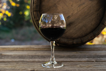 Red wine in wineglass on a gray background