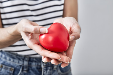 Red heart shape in the hands