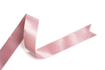 pink ribbon in roll on white