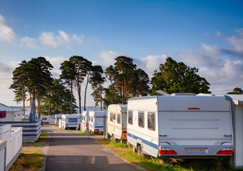 Camper trailers at norwegian holiday RV park - obrazy, fototapety, plakaty