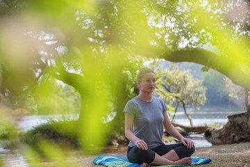 woman meditating and doing yoga exercise