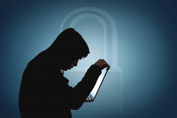Computer hacker silhouette of man is encrypting and releasing a virus to attack the data....