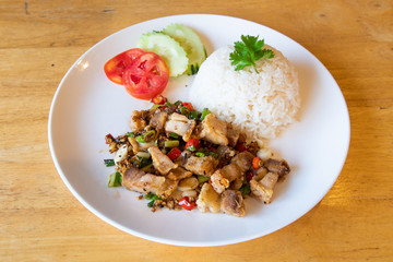 Fried crispy pork with rice.