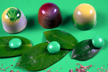 Top view of set of beautiful and delicious chocolate sweets decorated with assorted chocolate crumbs