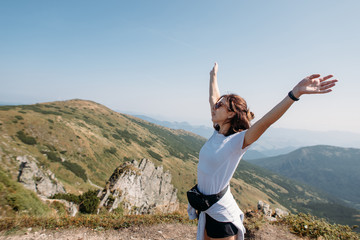 happy girl on top of the mountain