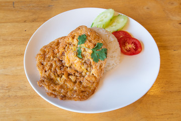 Omelette with rice on in a plate.
