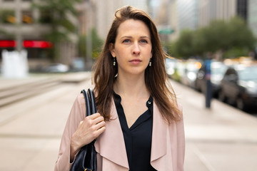 Business woman in city walking street