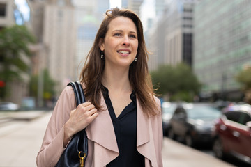 Business woman in city walking street