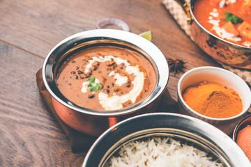 Dal makhani / makhni is a popular dish from India. Made with ingredients like whole black lentil, butter and cream. Served with Naan/roti and rice