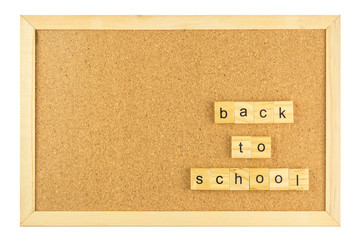 Back to school word on cork board in wooden frame isolated on white background.