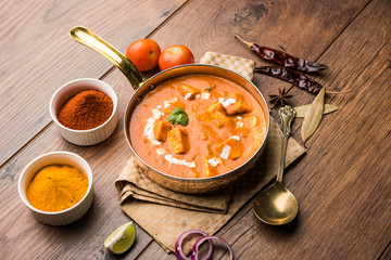 Paneer Butter Masala or Cheese Cottage Curry in serving a bowl or pan, served with or without roti and rice