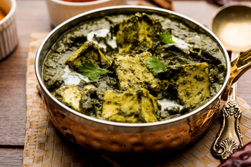 Palak Paneer Curry made up of spinach and cottage cheese served in a bowl or pan with roti or rice