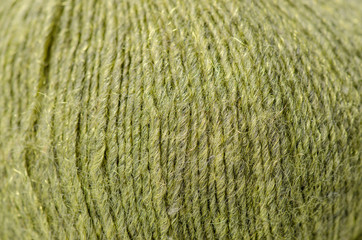 Green wool thread macro texture material blur background