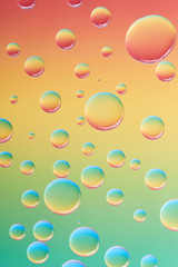 close-up view of beautiful calm transparent water drops on bright abstract background
