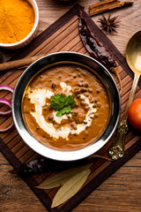 Dal makhani / makhni is a popular dish from India. Made with ingredients like whole black lentil, butter and cream. Served with Naan/roti and rice