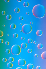 close-up view of beautiful calm transparent water drops on abstract background