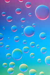 close-up view of beautiful calm transparent water drops on bright abstract background