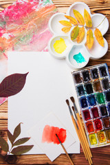 Set of artist accessories collection with autumn leaves. Canvas for painting, art brushes, palette.