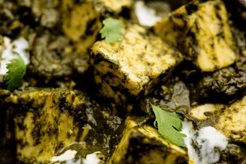 Palak Paneer Curry made up of spinach and cottage cheese served in a bowl or pan with roti or rice