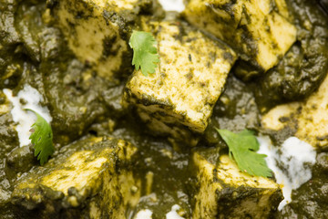 Palak Paneer Curry made up of spinach and cottage cheese served in a bowl or pan with roti or rice