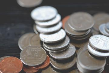 Rows of coins of Clock,cash,money, dollar on the table,finance and business concept,Tex time soft focus and blurred style,dark tone.