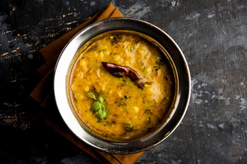 Dal Tadka Fry / Indian Lentil Curry served in a bowl with rice and roti, selective focus - obrazy, fototapety, plakaty