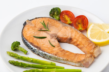 Salmon Grilled on a white plate isolated on white background.