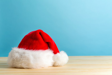 Obraz na płótnie Canvas Santa claus hat on a blue background