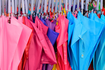 storage of different colors umbrella.Colorful umbrellas background.