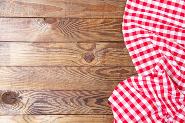 Brown old vintage wooden table with framed red checkered tablecloth.Thanksgiving day and Cristmas...