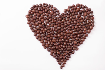 Candy and sweets isolated on white background. Heart shape. Top view. Selective focus. Copy space and mock up