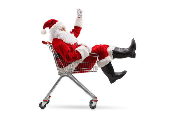 Santa Claus sitting inside a shopping cart