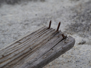 Rusty nails stick out of the board very dangerous.
