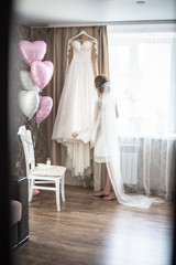 bride in a wedding dress, Wedding Dress, wedding dress hanging