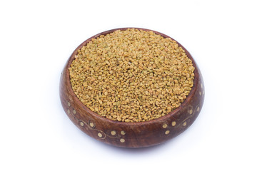 Dried fenugreek seeds isolated on white background