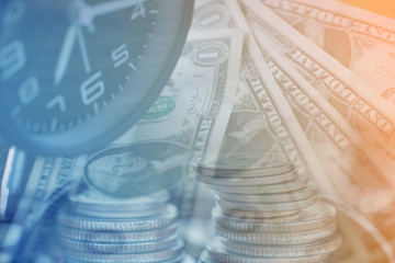 Double exposure Rows of coins of Clock,cash,money, dollar on the table,finance and business concept,Tex time soft focus and blurred style,dark tone.