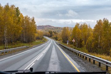 autumn view of the highway from the cab