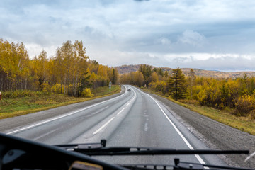autumn view of the highway from the cab