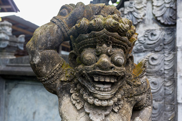 Fototapeta na wymiar Traditional stone statues depicting demons, gods and Balinese mythological deities in Bali,Indonesia