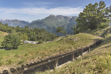 Fototapeta na wymiar Trench from the first world war at Isonzo front with mountain Krn in background, Slovenia