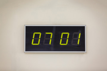 Black digital clock on a white background showing time 07.01 minutes