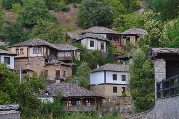 Stone house with stone fence in the Village of Leshten. Historical, facade. The Village of Leshten is architectural reservation