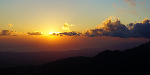beautiful sunset with clouds over the mountains