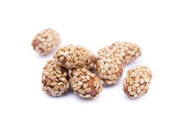 Coated peanuts with sesame isolated on white background