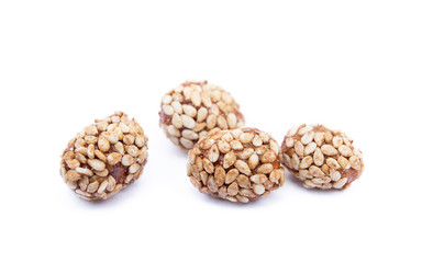 Coated peanuts with sesame isolated on white background